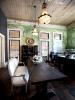 Palazzo Lavaca, Austin — The farmhouse style kitchen table is accompanied by state of the art appliances.
