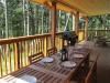 Cosy Woodpecker Cottage, Salt Spring Island — The large covered deck would make an excelled location for a small intimate wedding ceremony.
