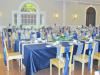 From Menus to Venues, Saint John — This is a photo of a beautiful head table designed for a wedding at Rothesay Netherwood School. This wedding was done in Navy Blue, Gold and Silver.
