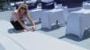 From Menus to Venues, Saint John — Our lead planner taping down an aisle runner on a windy day! Without a wedding planner, who would do this for you? The wedding party was all getting there pictures done when the wind picked up!