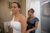 Roland Photo and Video Services, East Weymouth — The mother helping the bride with the dress.