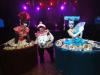 Aerial Artistry, Hollywood — Dessert Tables-Living Tables- Strolling Tables
Greet your guests upon arrival with a gorgeous human strolling table serving glasses of champagne. Our beautiful stroling tables can hand out items place cards, name badges, candy, cigars, mardi gras beads, casino chips, celebrate look like programs and more. They will get the attention of anyone who passes by or since they are mobile, they can go to where the guests are. All of our costumes are custom made for your event. We can create any theme or character you like. If you have a product or logo to promote, we can integrate it into our costuming.